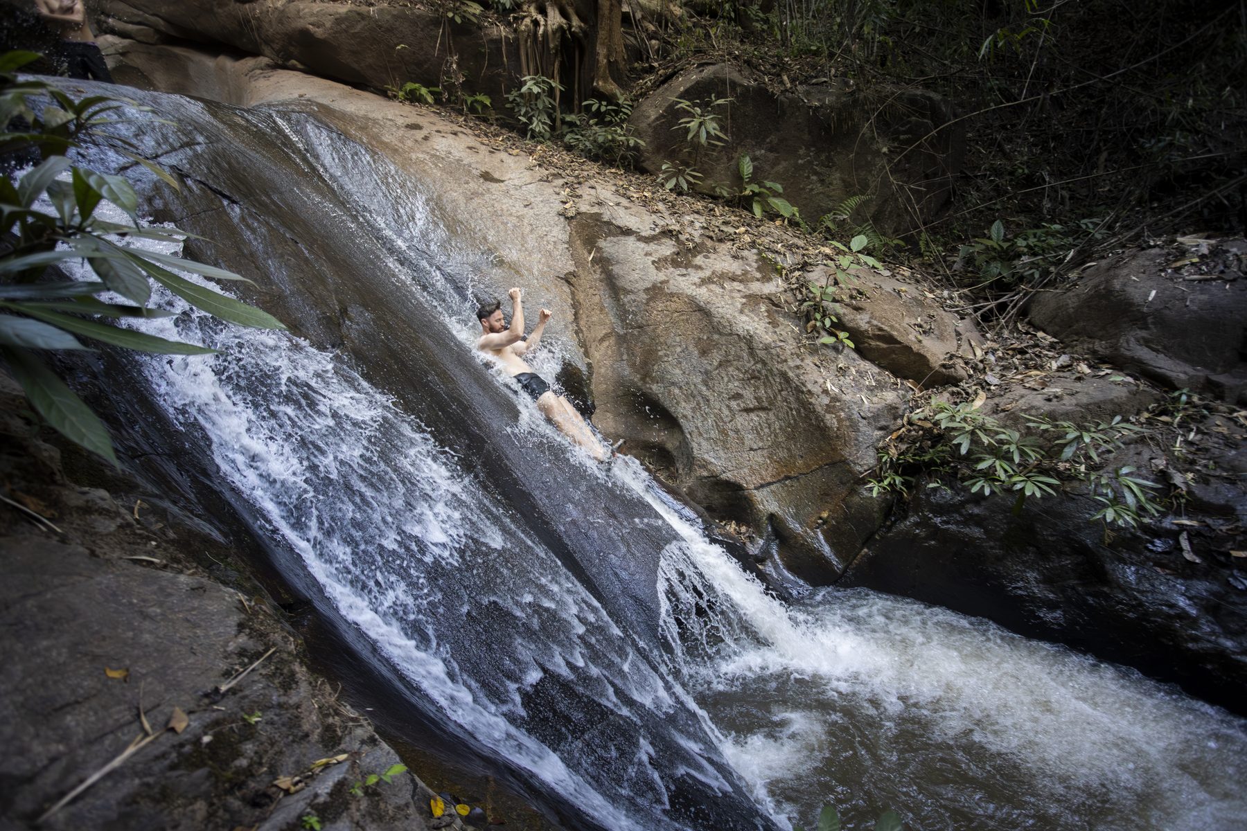 SaGee Waterfall natural rock slide, a five-minute walk behind the Tubing Chiang Mai base camp