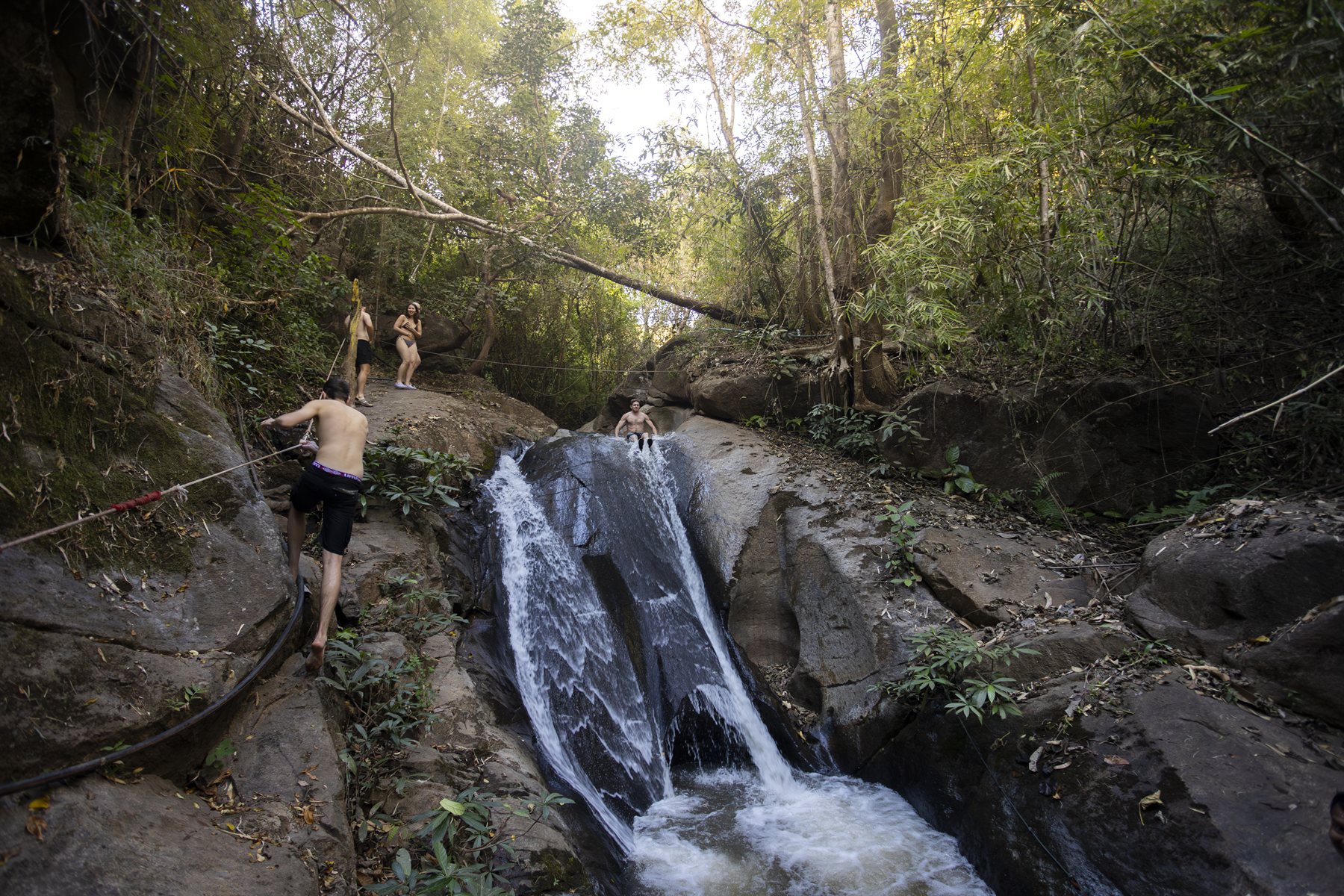 Swimming at the hidden jungle waterfall in Mae Taeng
