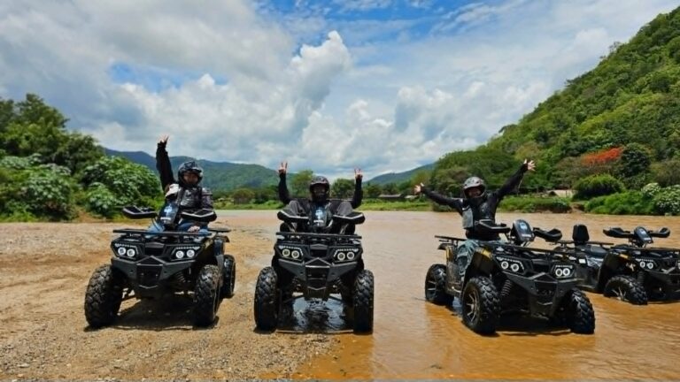 Three guests celebrating on ATVs by the Mae Taeng river, Chiang Mai