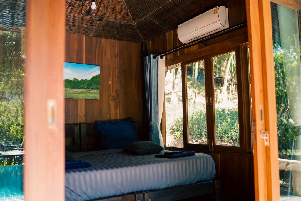 Poolside Villa bedroom opening onto the water