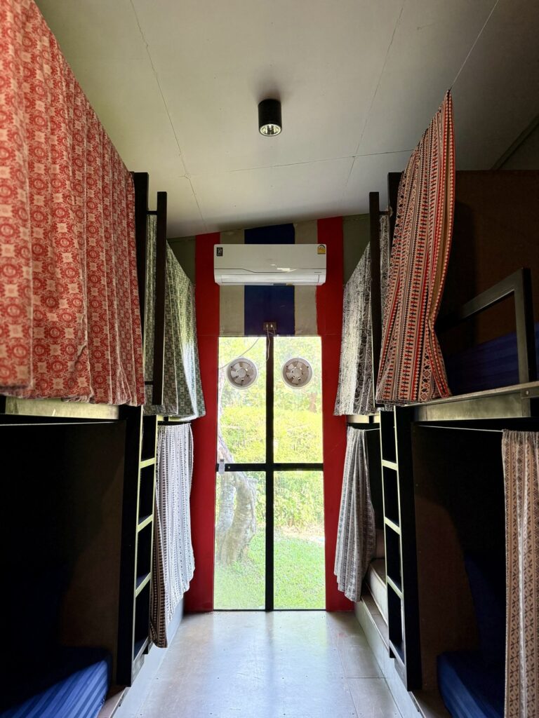 Air-conditioned 16-bed dorm with privacy curtains on every bunk