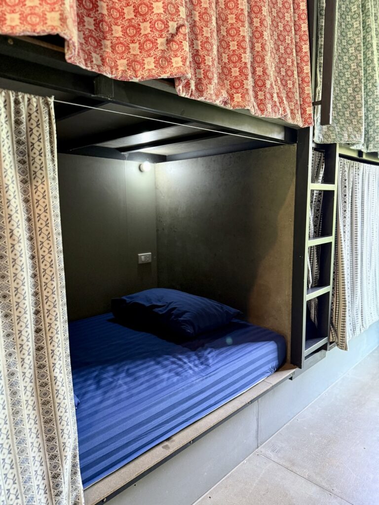 Bed pod with privacy curtain in the air-conditioned dorm