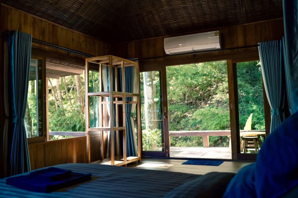 Corner villa room with folding doors opening to the garden