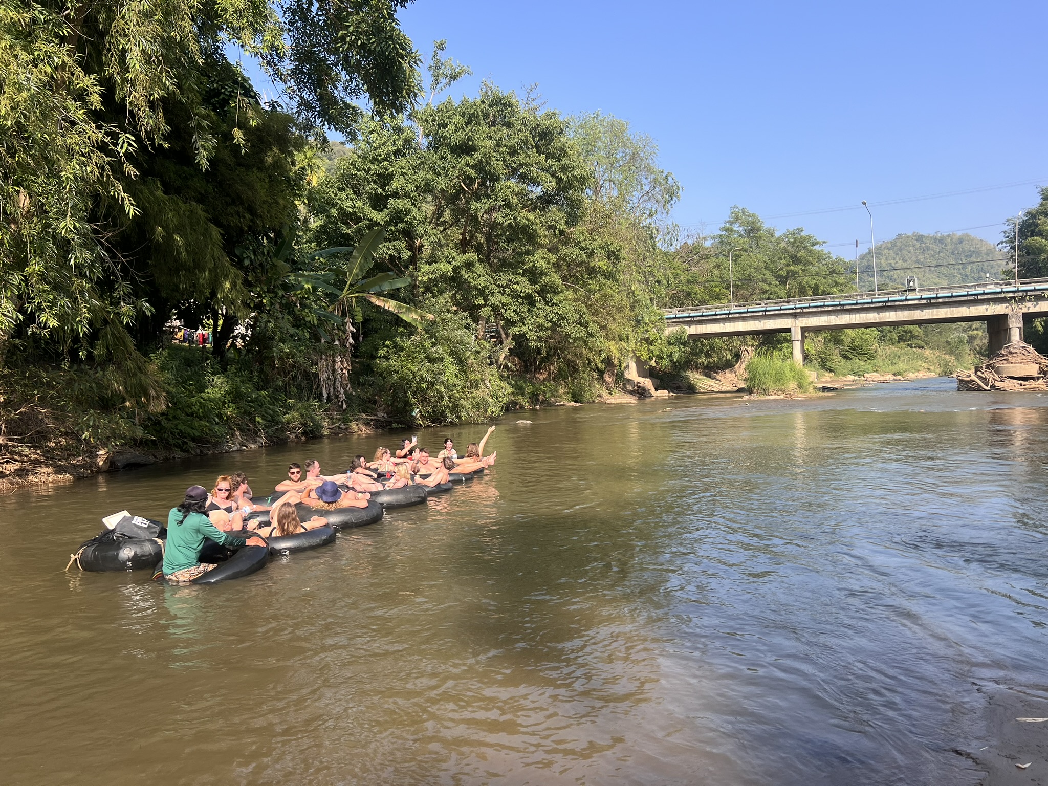 The tube raft floating under the Mae Taeng bridge on the afternoon run